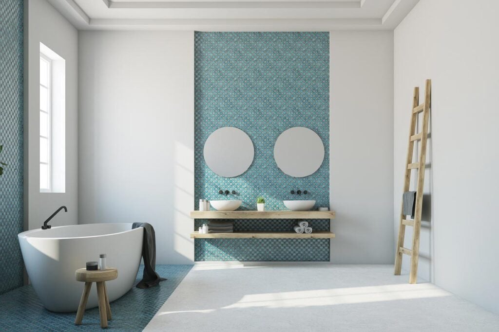 A white bathroom with blue mosaic interior
